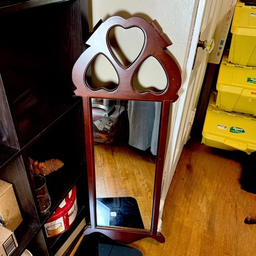 Vintage Dark Finish Wood Frame Mirror with Cut-Out Hearts on Top made by SEI.